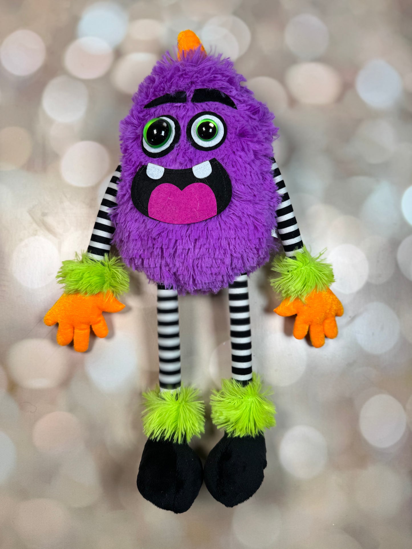 15.25"H PLUSH MONSTER W/HORN DECOR PURPLE/LIME/BLK/WHT/ORG - Burlap and Bling Decor