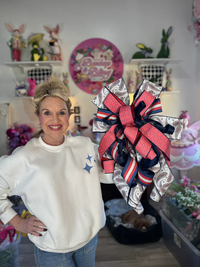 Jen displays an elegant patriotic bow perfect for anchoring a DIY summer wreath