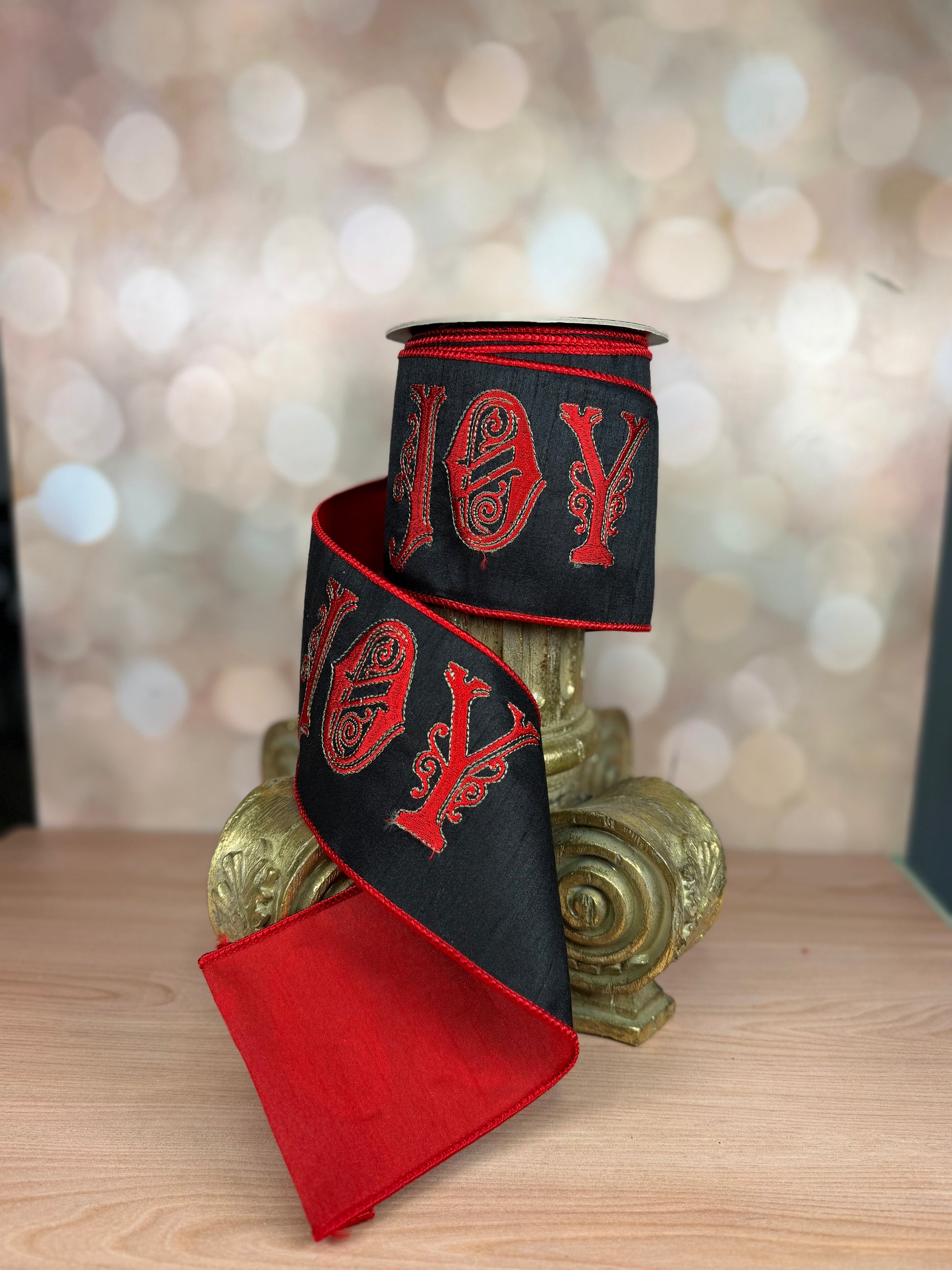 4" x 10 yds JOY EMBROIDERY ON BLACK DUPIONI AND RED BACKING - Burlap and Bling Decor