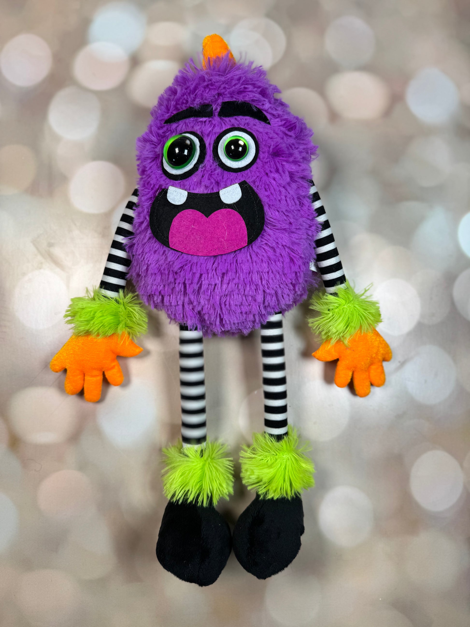 15.25"H PLUSH MONSTER W/HORN DECOR PURPLE/LIME/BLK/WHT/ORG - Burlap and Bling Decor